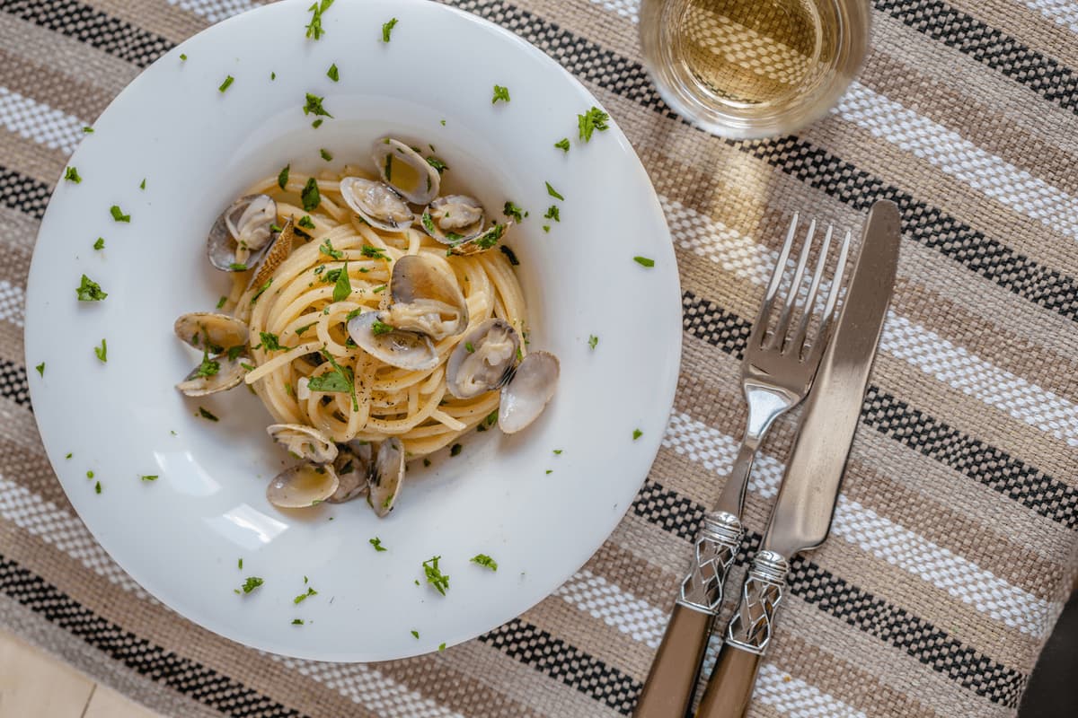 Spaghetti alle Vongole: Delicate clams, sautéed in garlic and white wine